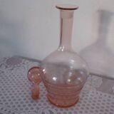 Pink transparent glass carafe with bubble cap