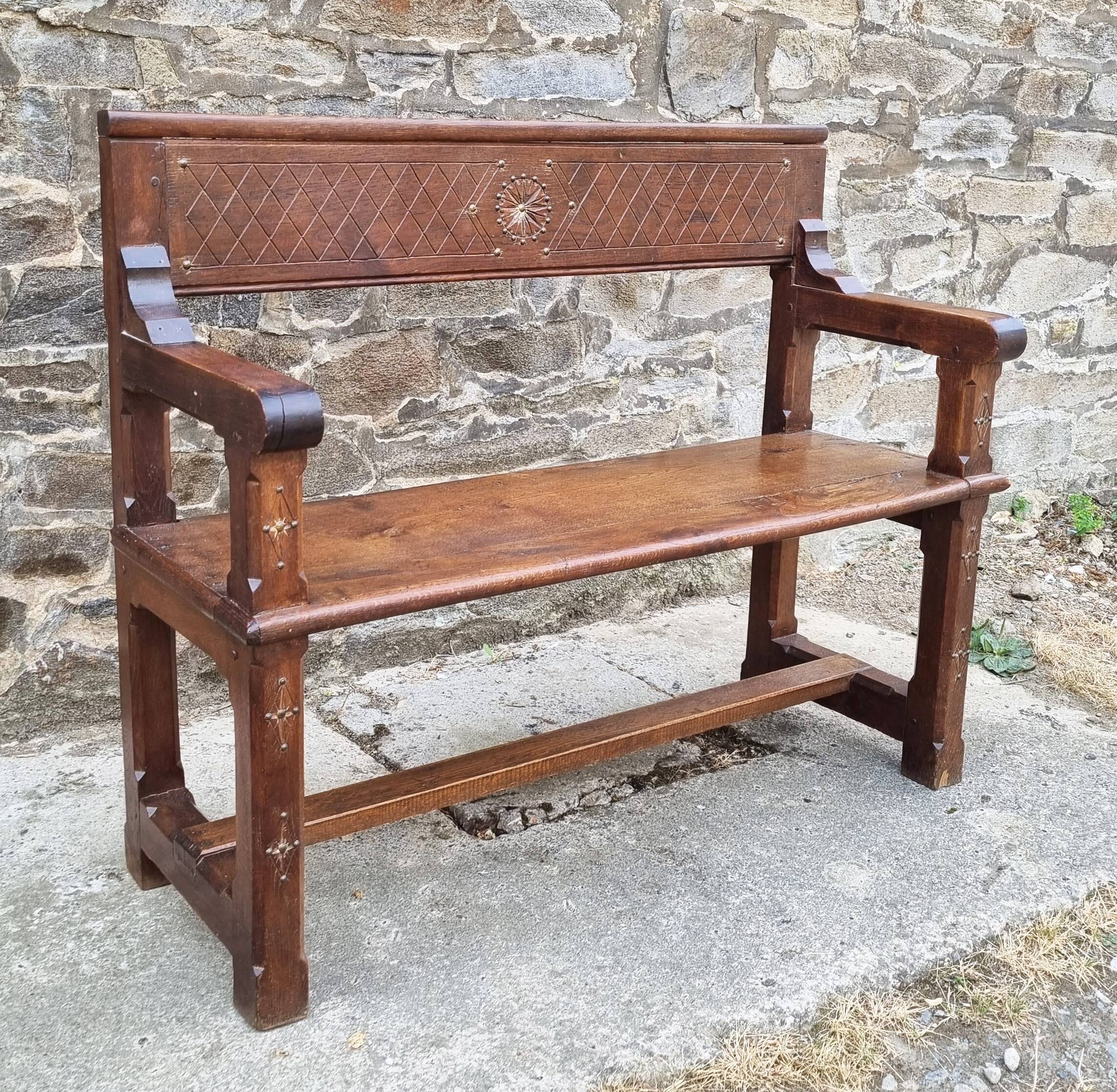 Stylized church pew, early twentieth century, solid wood