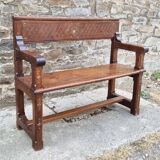 Stylized church pew, early twentieth century, solid wood