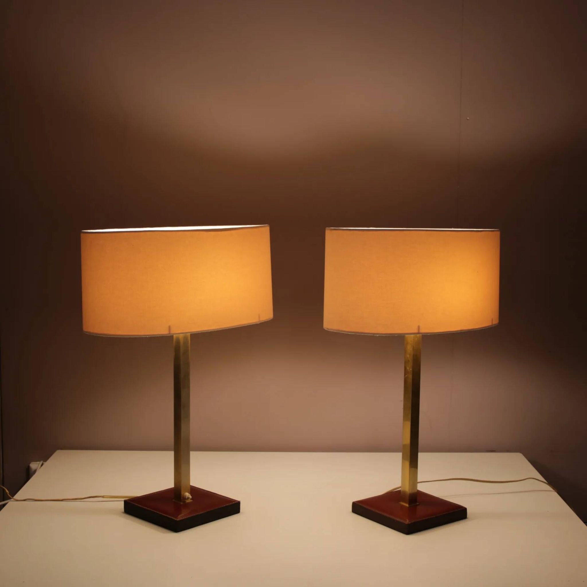 Pair of leather and brass table lamps from the 1960s, originating from Belgium.