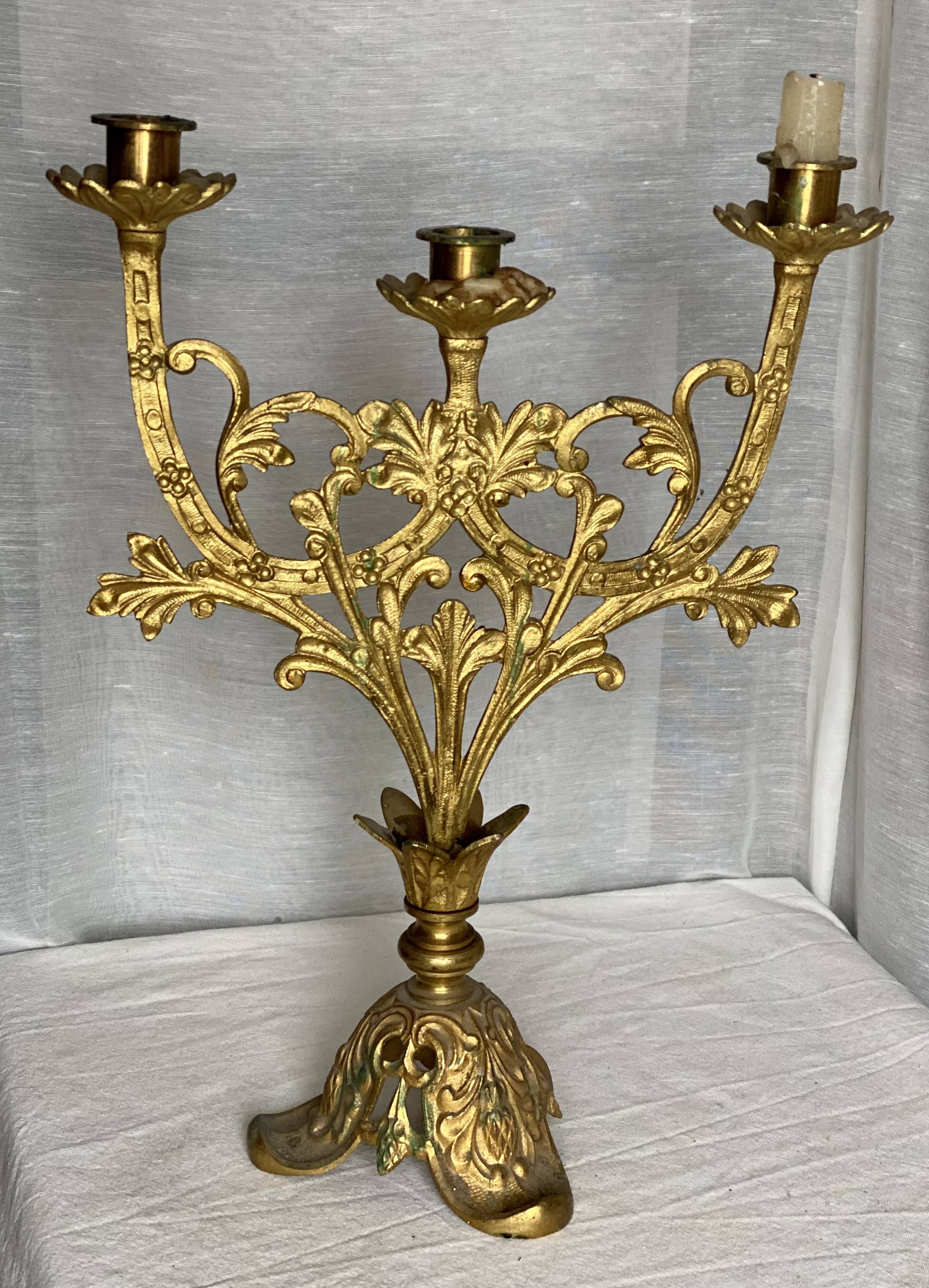 Set of 3 gilt metal candlesticks from the early 20th century.