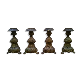 Four antique candle holders