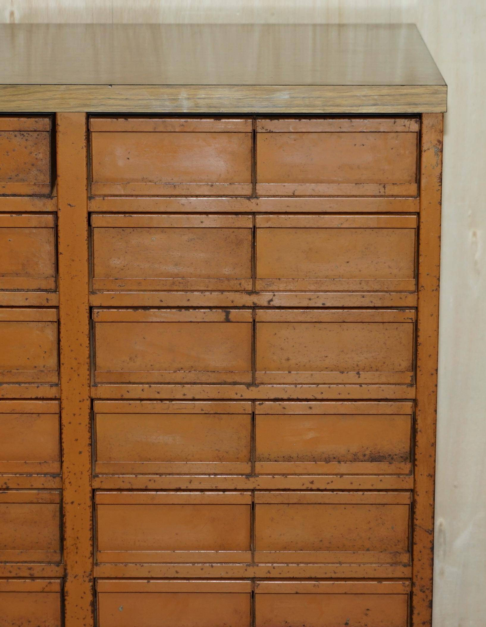 Industrial metal chest of drawers with 30 drawers.