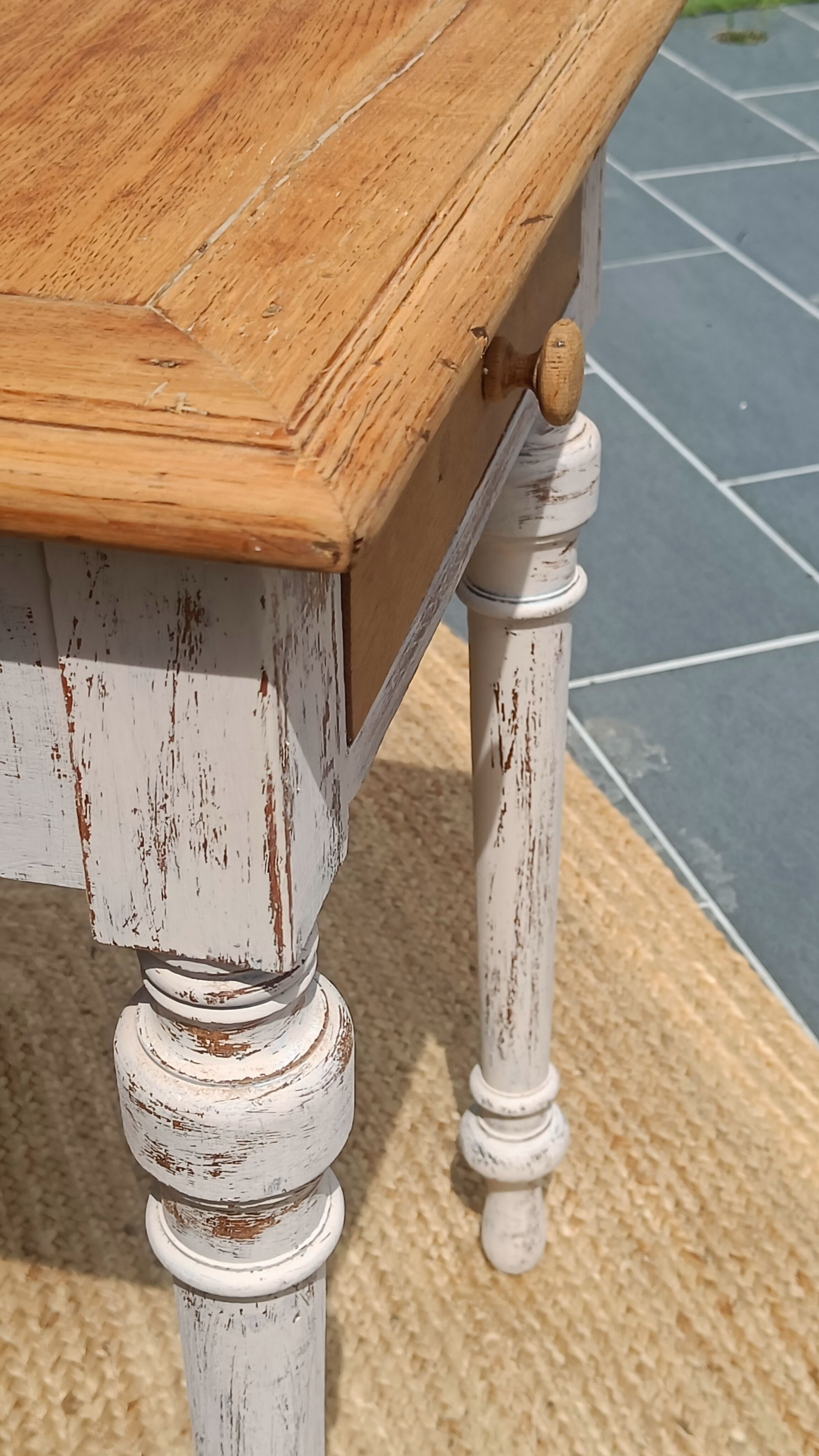 Antique drawer table with a patina.