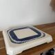Vintage old trivet Badonviller blue graphic pattern