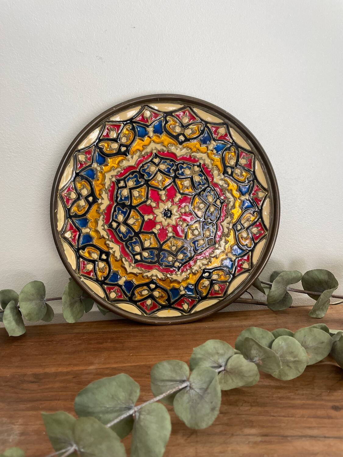 Enamelled brass plate