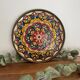 Enamelled brass plate