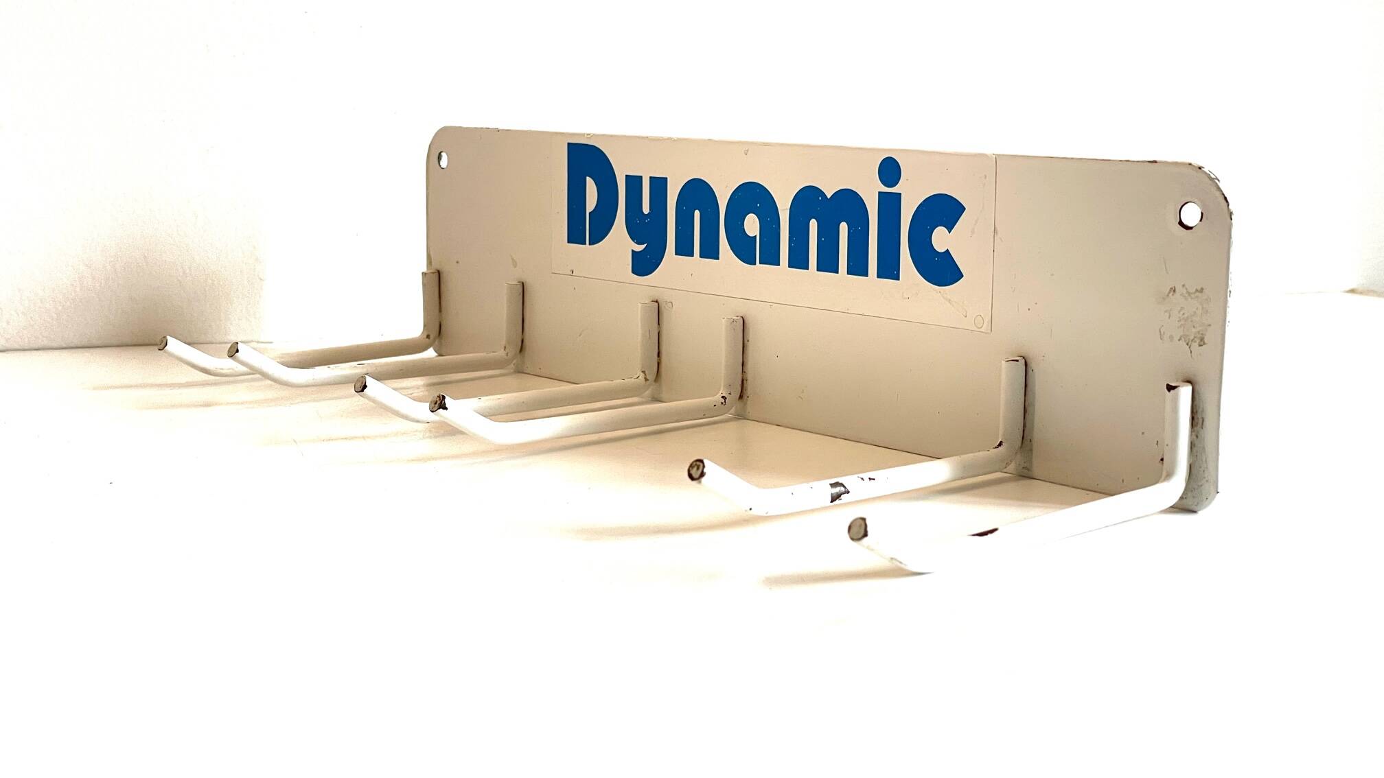 Vintage white metal wall trade coat rack