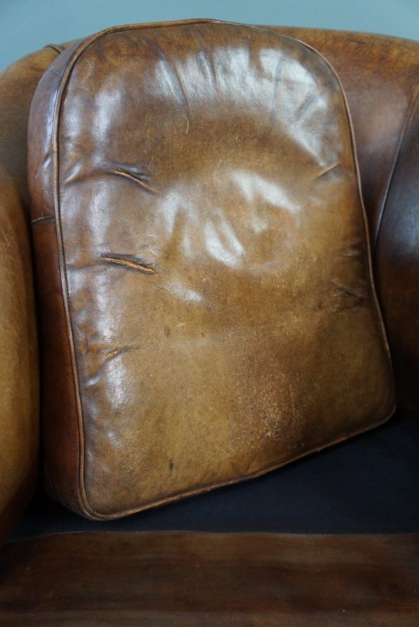 Club chair in patinated sheepskin