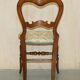 Victorian walnut dressing table chair from around 1880 with a medallion on the backrest.
