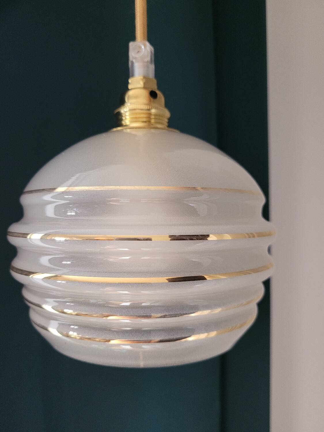 Frosted glass lamp with golden trims