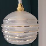 Frosted glass lamp with golden trims