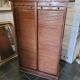 Double curtain binder in blond mahogany