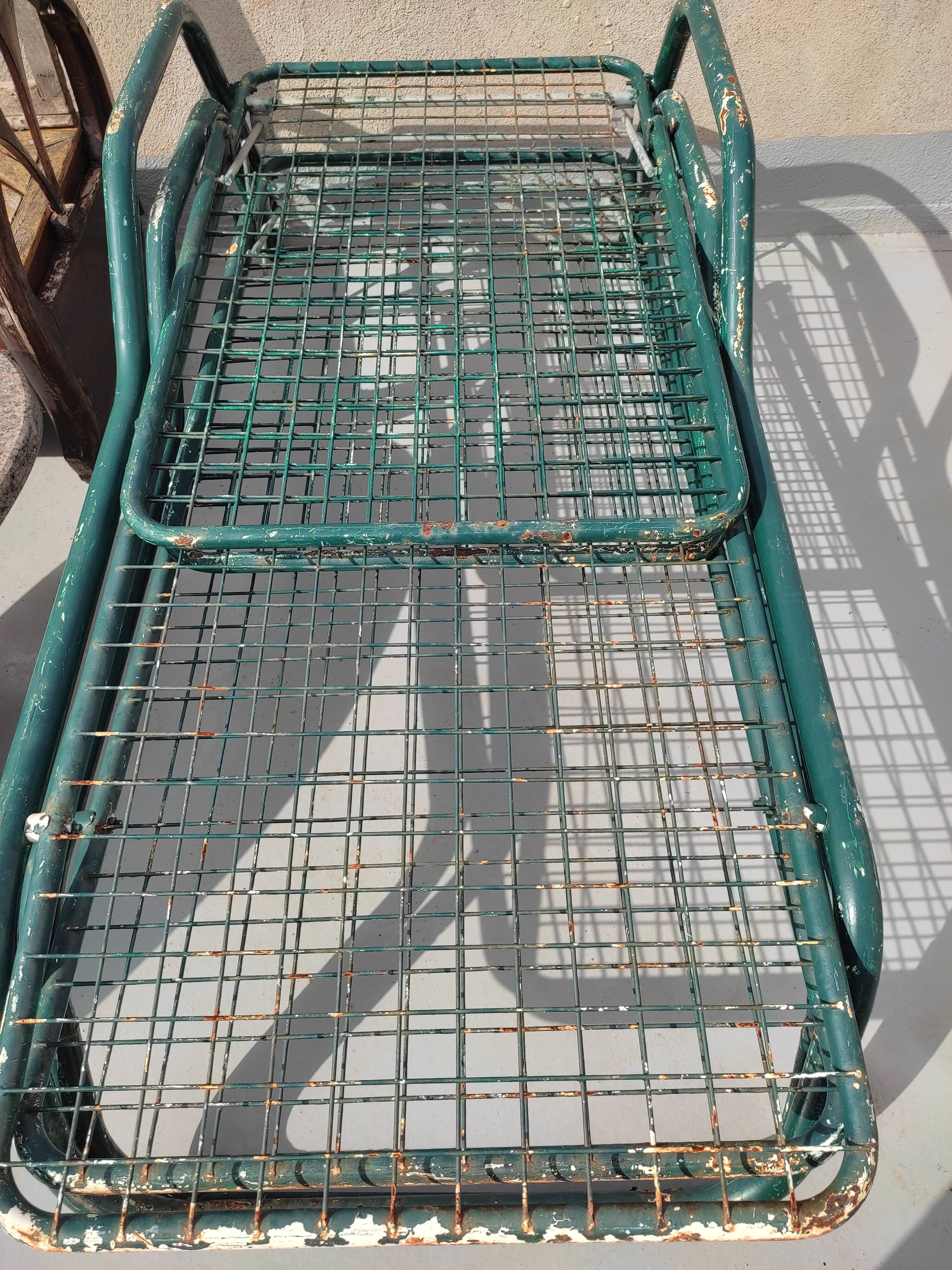 Pair of metal deckchairs