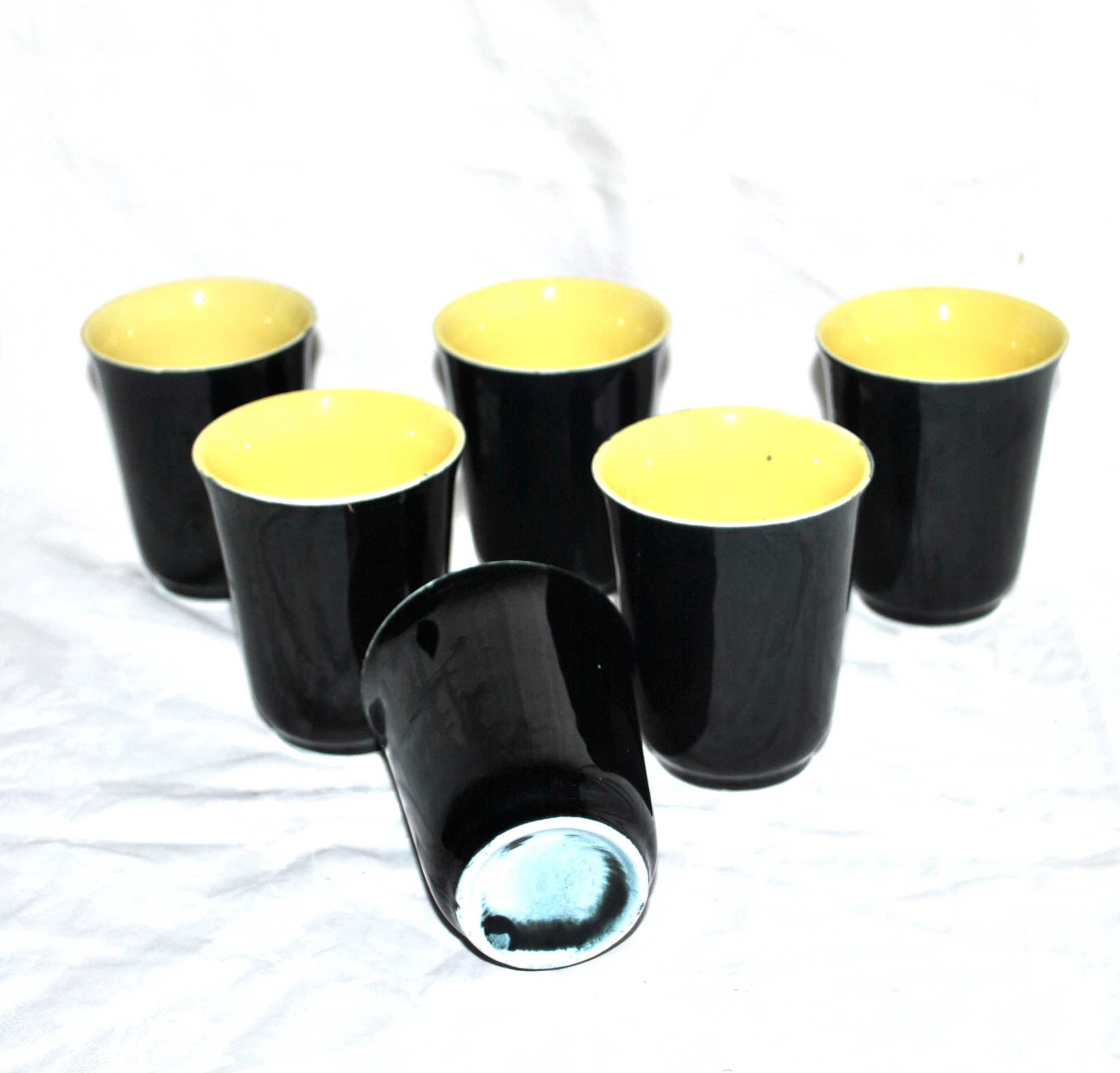 12 glasses in black and yellow ceramic