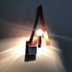 Pair of triangular wall sconces in chrome metal and orange. 1970s.