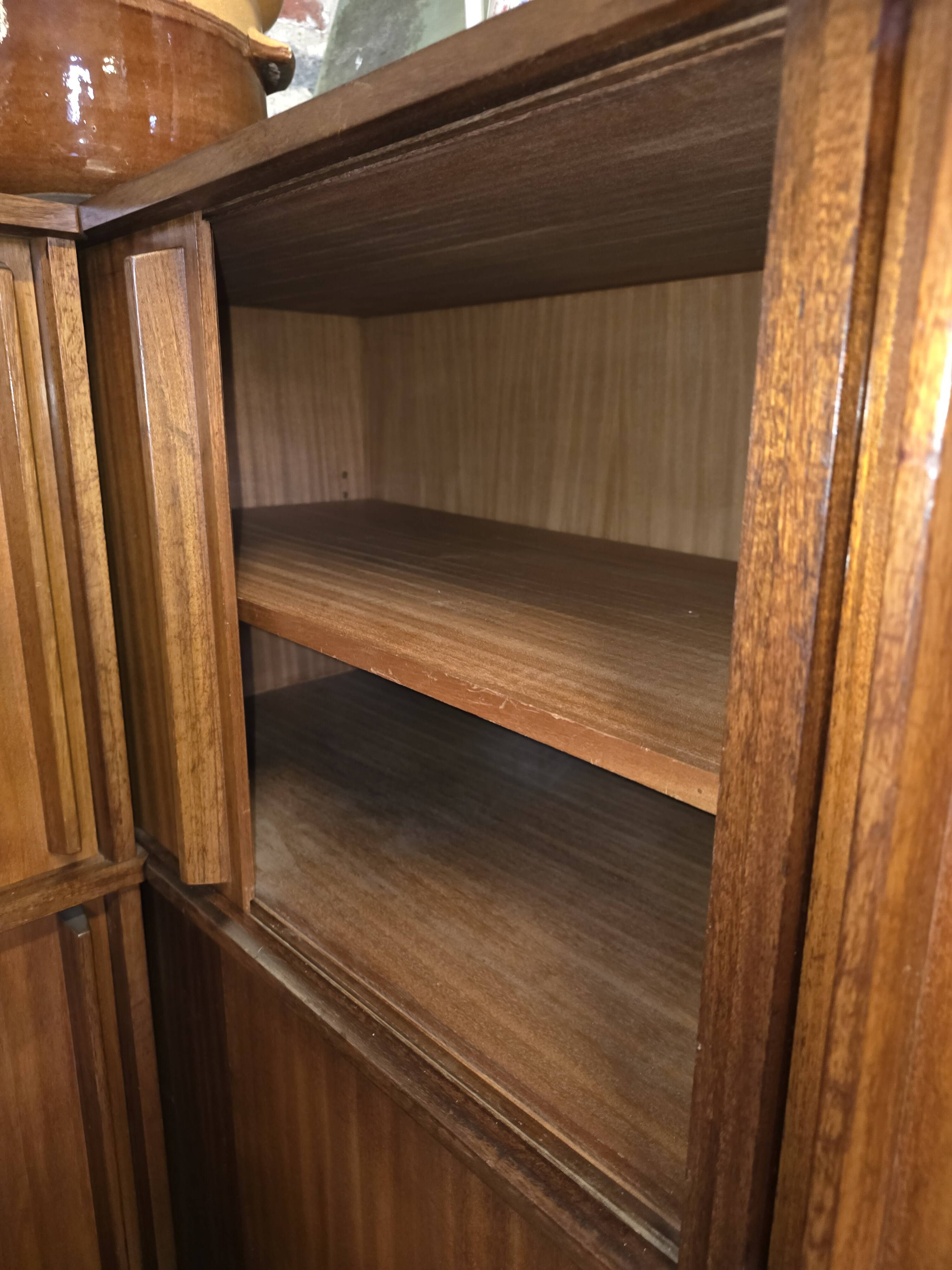 Modular corner library Oscar from the 1960s with sliding doors.