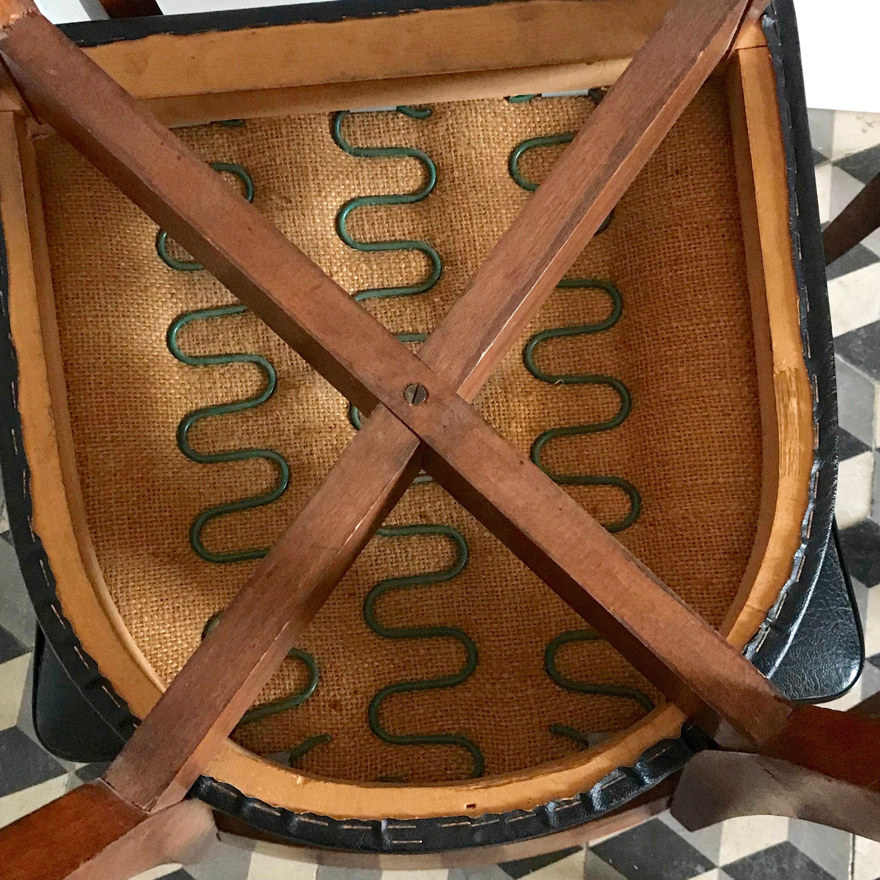 Vintage wooden and black skai chairs