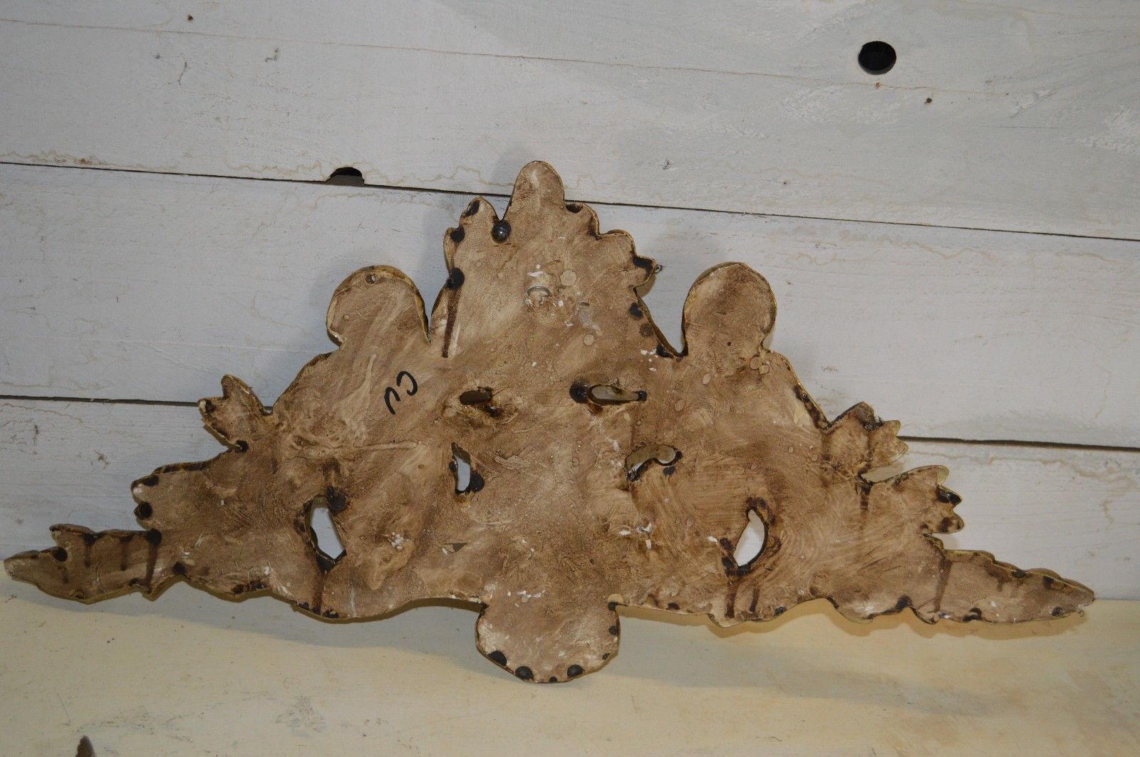 Pediment with patinated characters golden