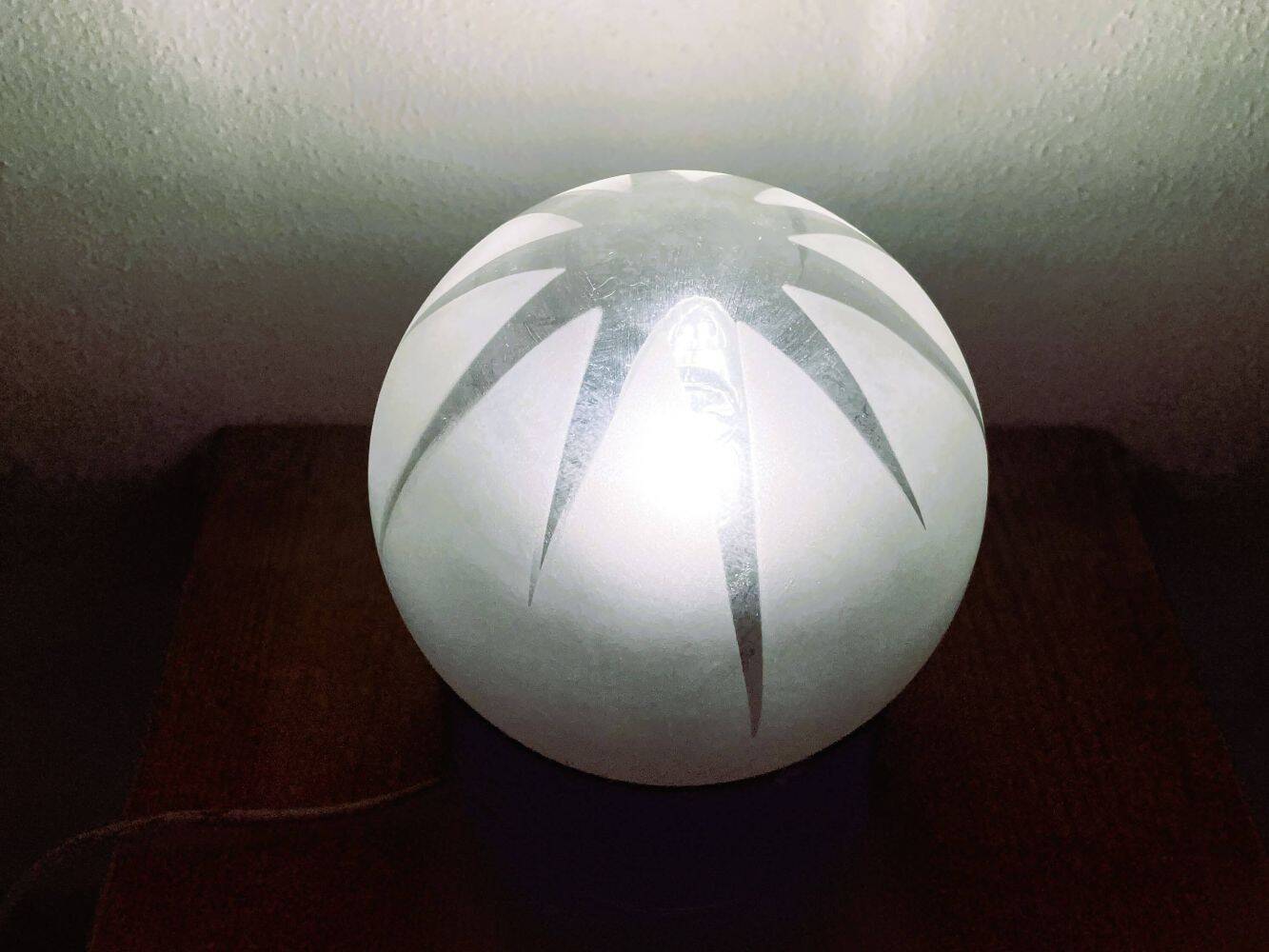 Small black wooden table lamp with frosted glass globe