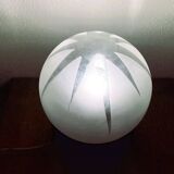 Small black wooden table lamp with frosted glass globe