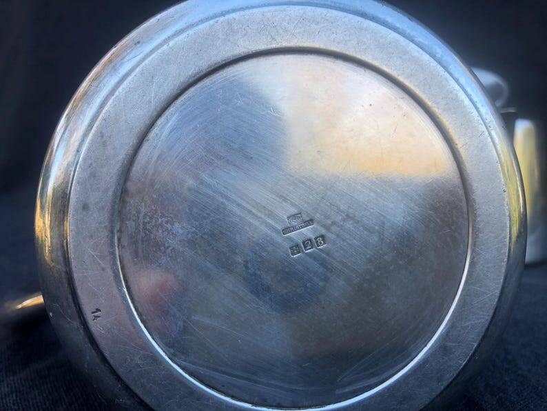 A pair of vintage silver-plated teapot and coffee pot