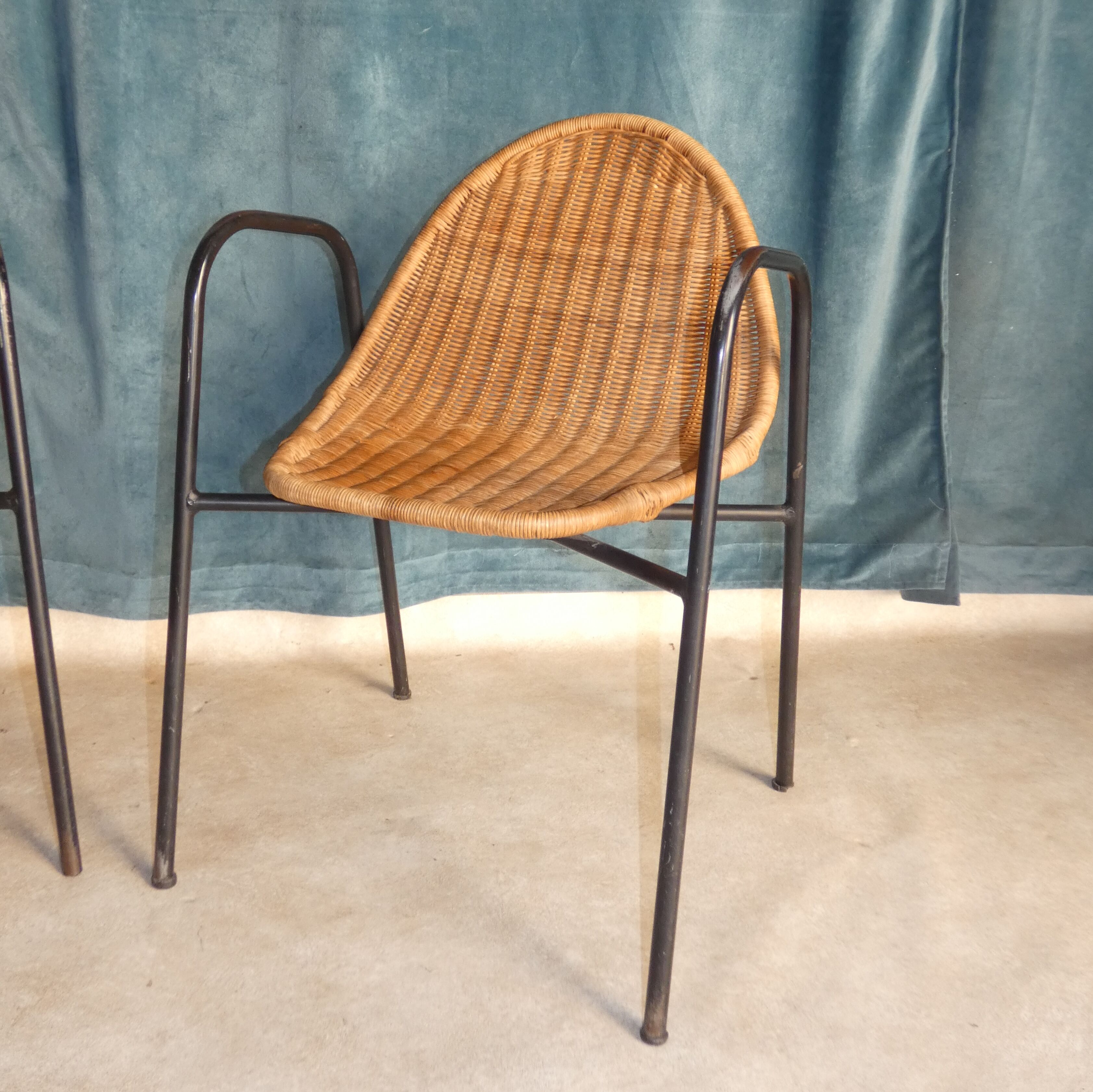 Pair of chairs / vintage armchairs in rattan and black lacquered metal