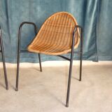 Pair of chairs / vintage armchairs in rattan and black lacquered metal