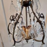 Small bronze "cage" chandelier with three lights decorated with tassels and pendant. Late 19th century
