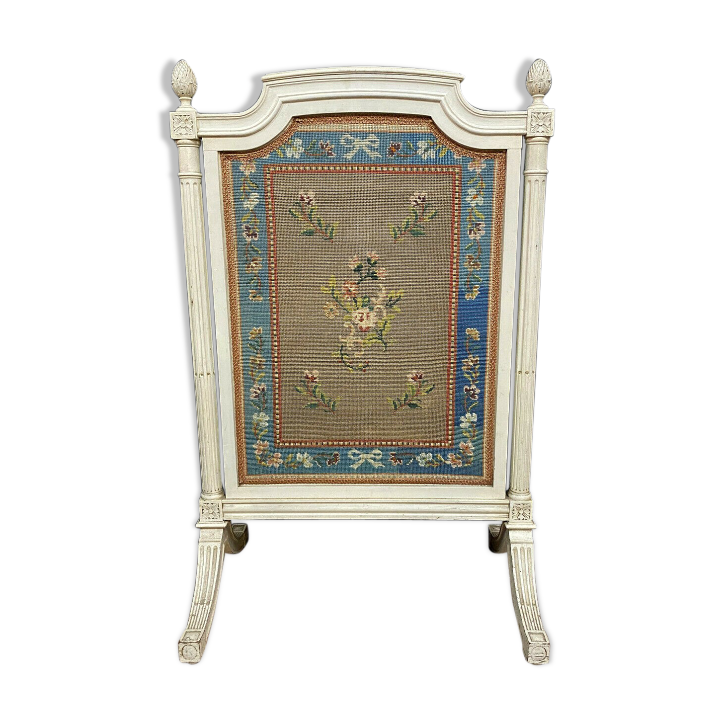 Front of Louis XVI fireplace in laqué wood and fabric has floral decorations