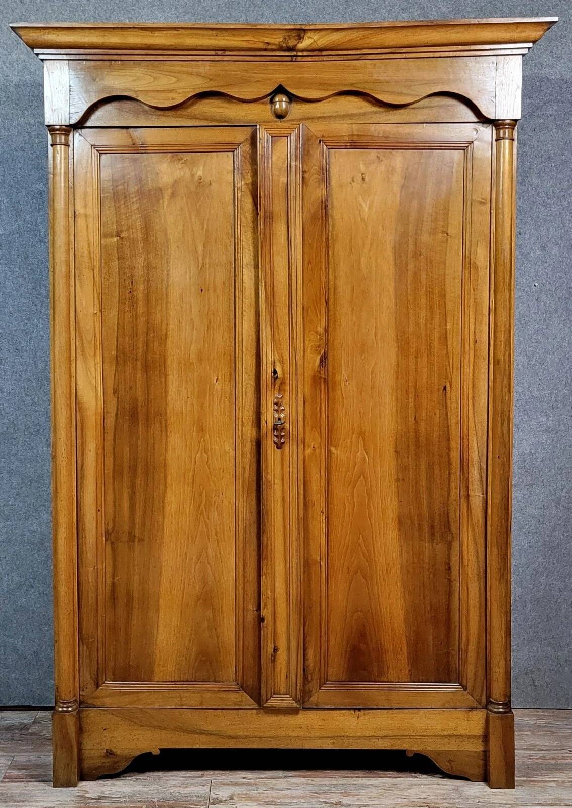 Exceptional Empire period wardrobe in solid walnut, 19th century, circa 1800