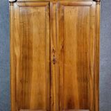 Exceptional Empire period wardrobe in solid walnut, 19th century, circa 1800