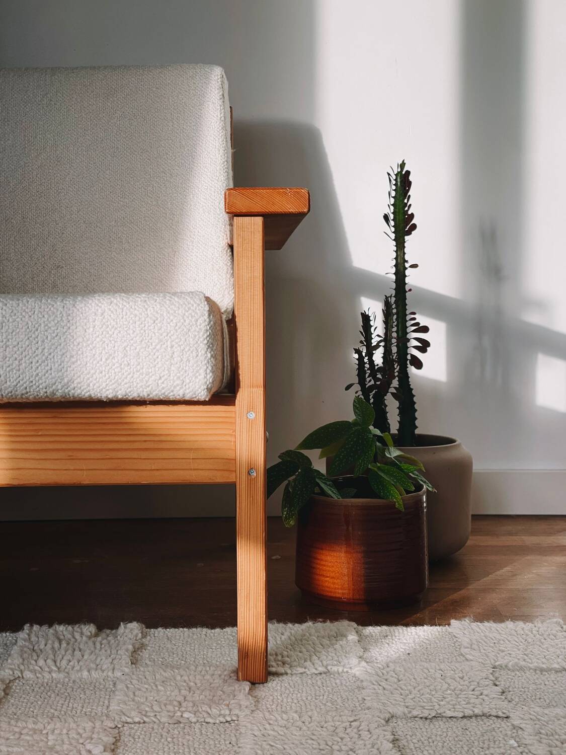 Brutalist armchair in wood and bouclé fabric