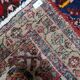 1950s handmade wool medallion rug, red and navy, 96 × 144 cm - 1C1290