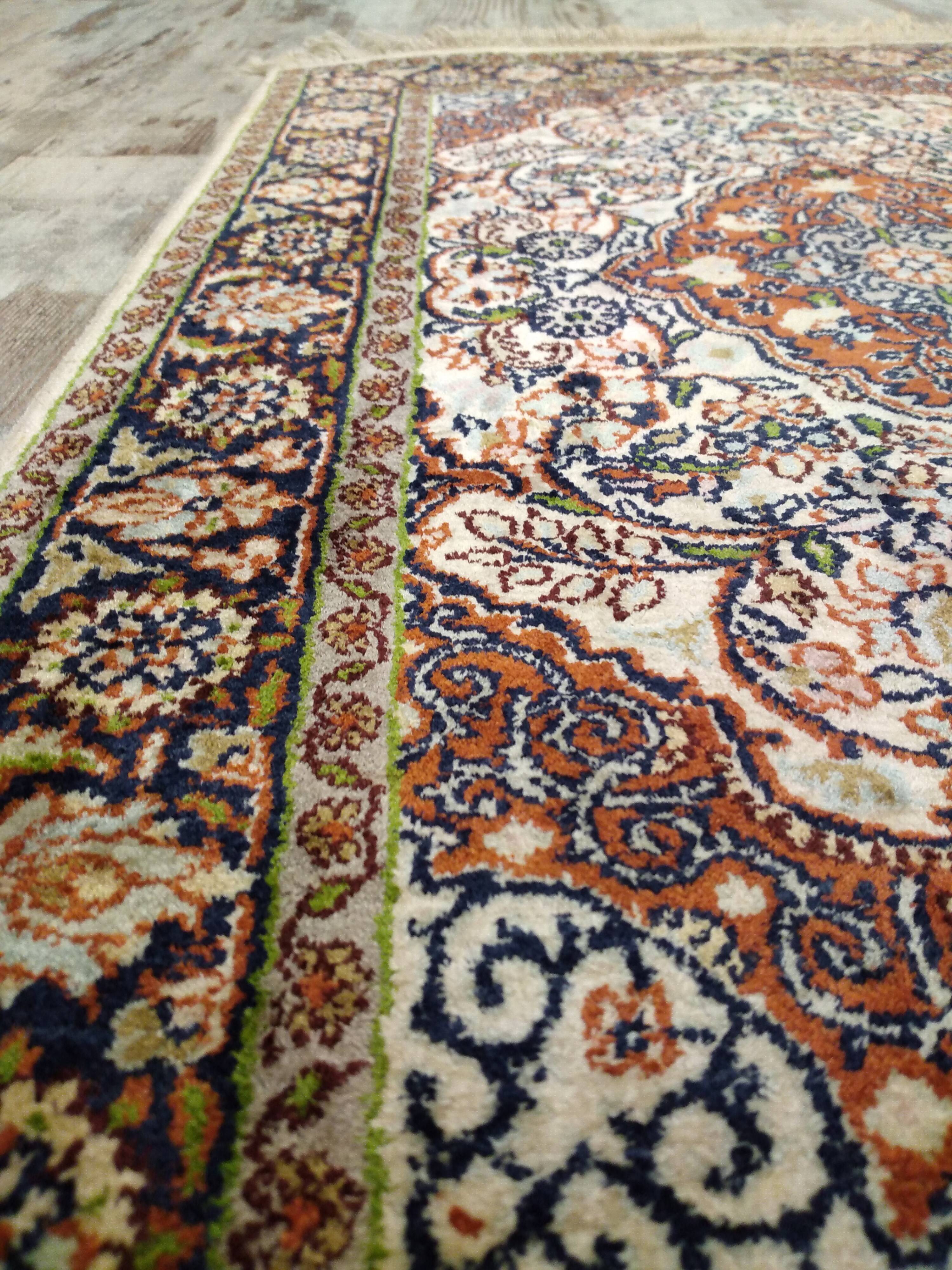 Handmade Persian wool and silk rug