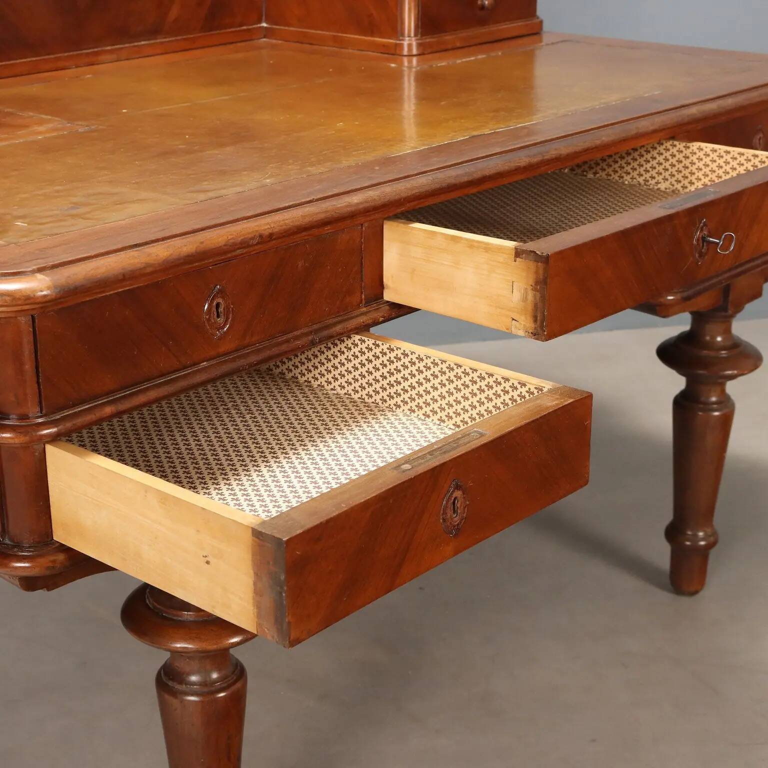 Antique walnut desk with a leather-covered top, Italy, late 19th century.