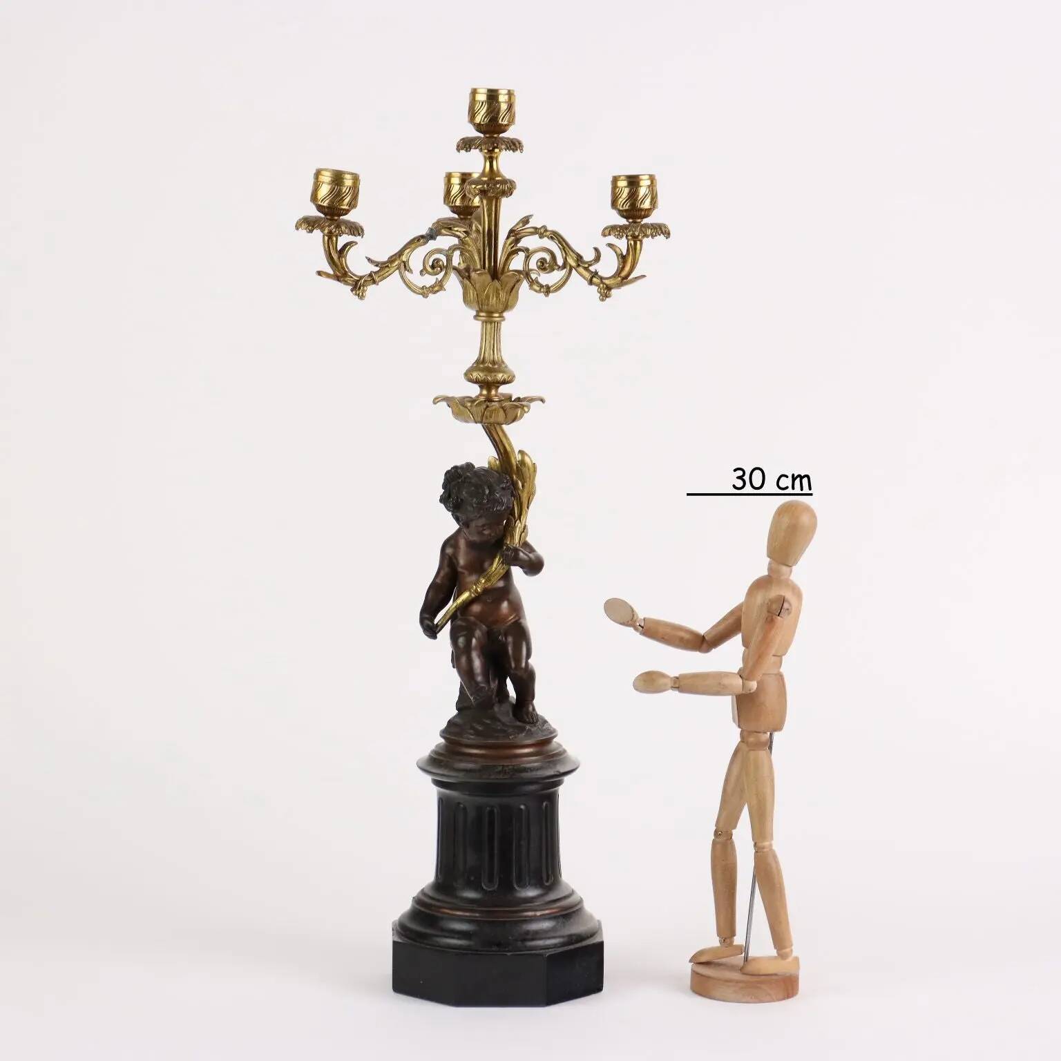 Antique candelabrum in bronze and black marble, Europe, 19th century.