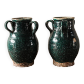 Set of two Chinese green glazed stoneware storage jars.