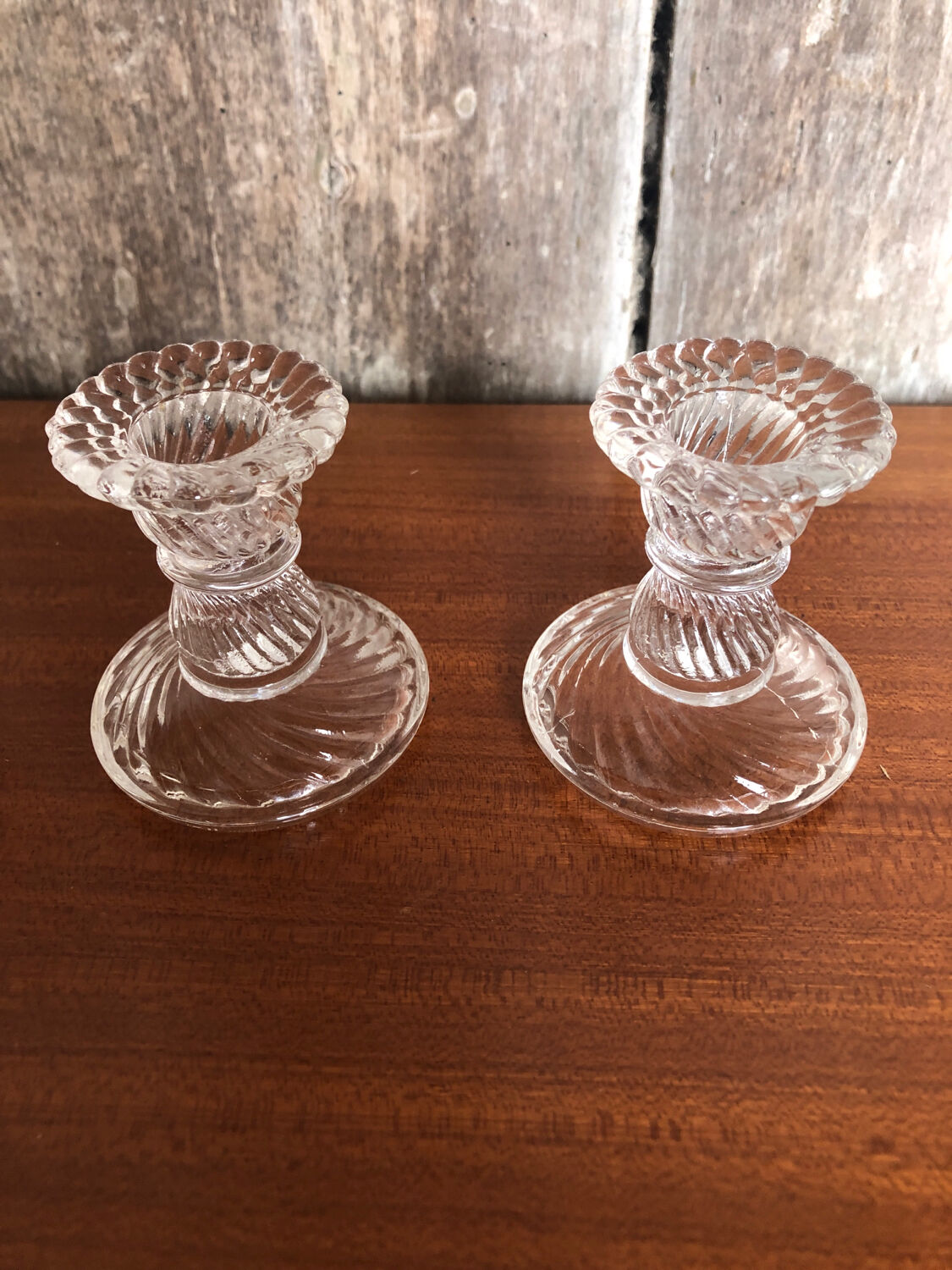Old pair of vintage round molded glass candle holder