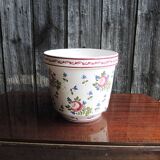 Vintage ceramic pot with hand-painted floral decoration.