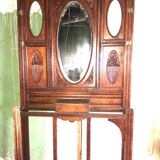 Very decorative coat rack with bevelled mirror.