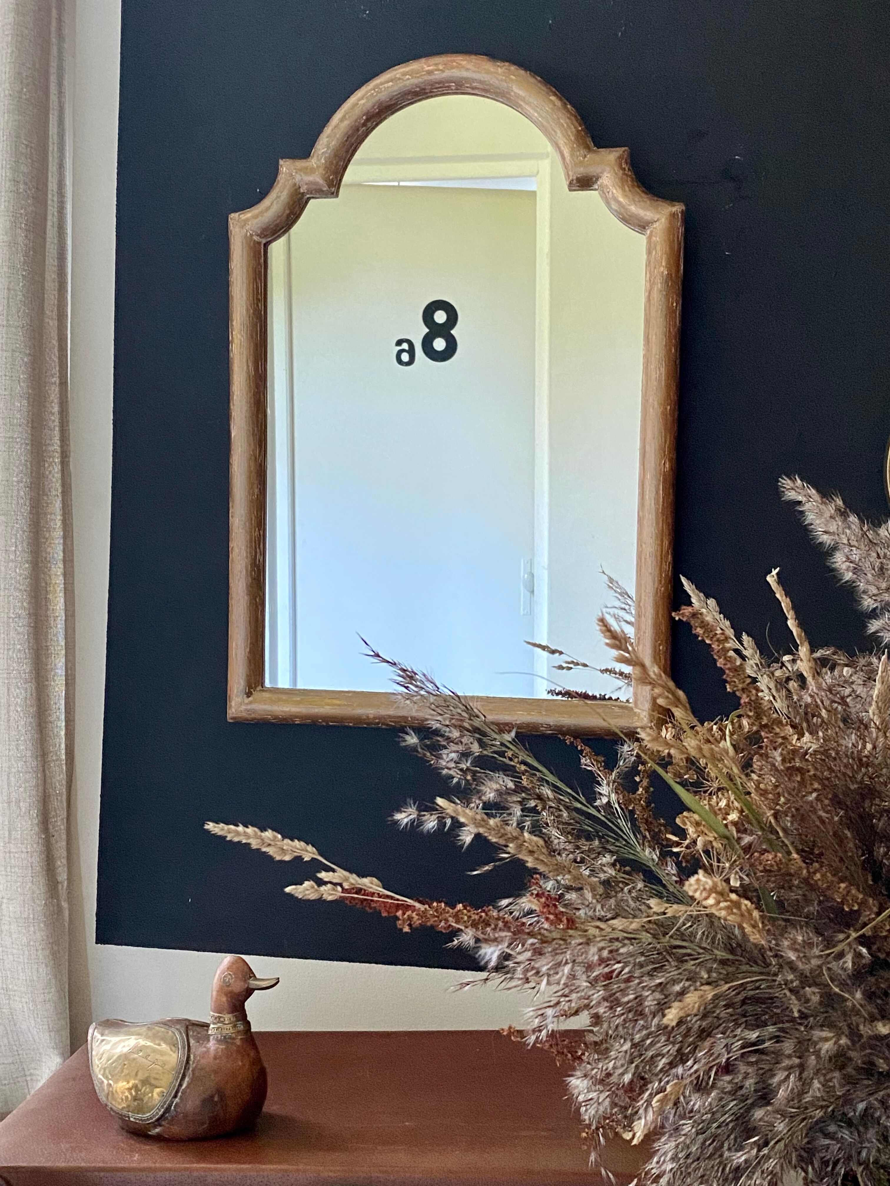 Patinated gilded mirror in wood and plaster