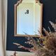 Patinated gilded mirror in wood and plaster