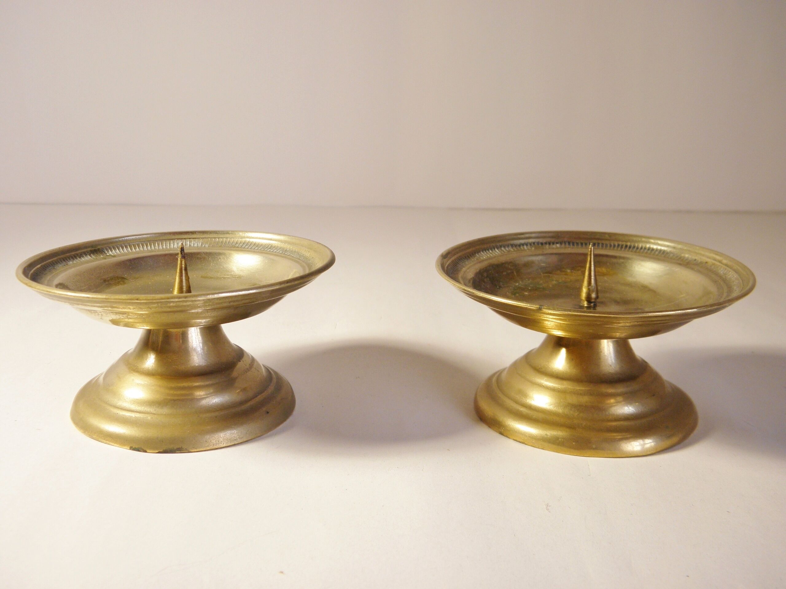 Pair of golden brass candlesticks