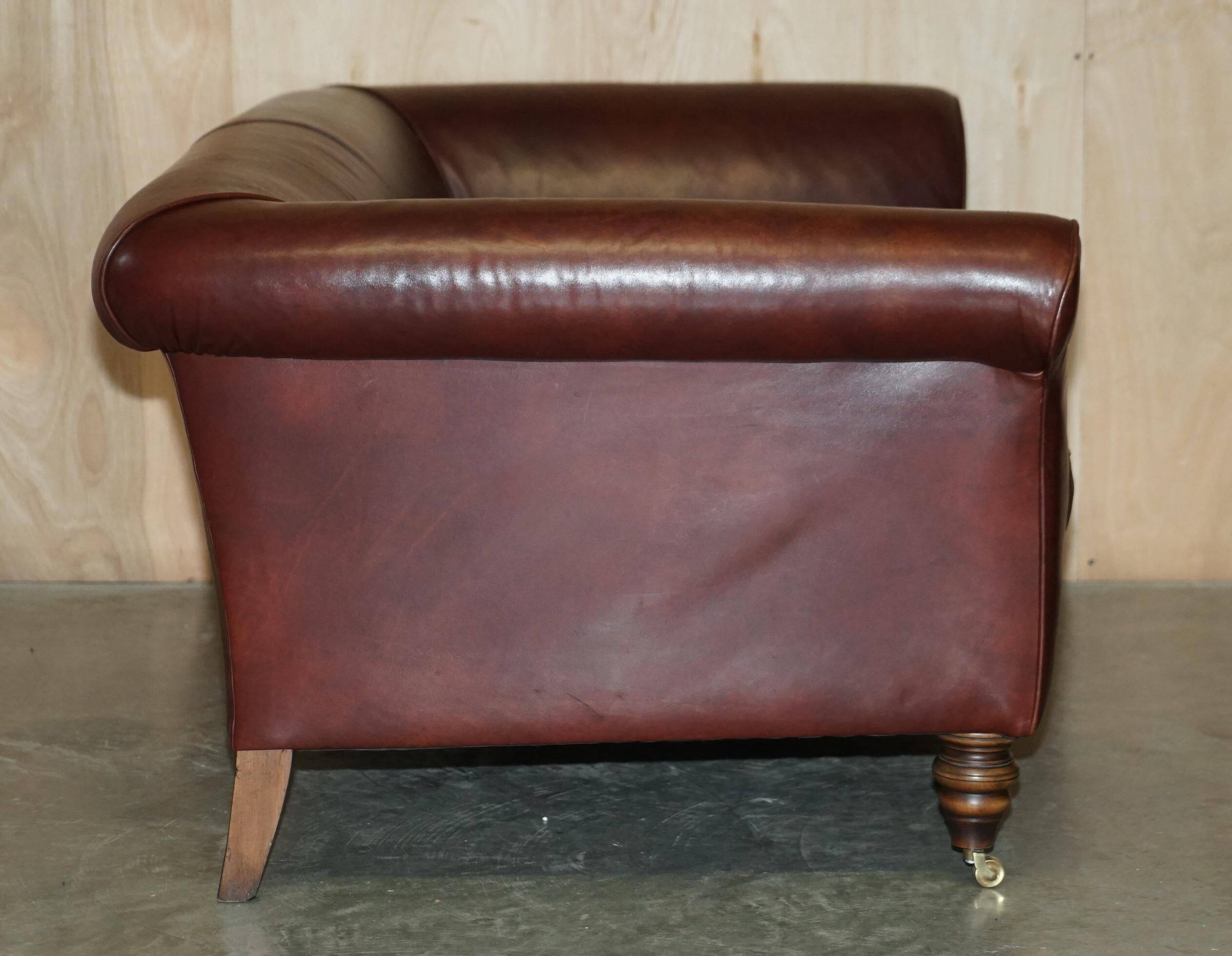 Vintage Art Deco leather sofa, three-seater, feather cushions.