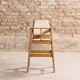 Children's high chair in solid tinted beech, seat and back in imitation cream leather, certification