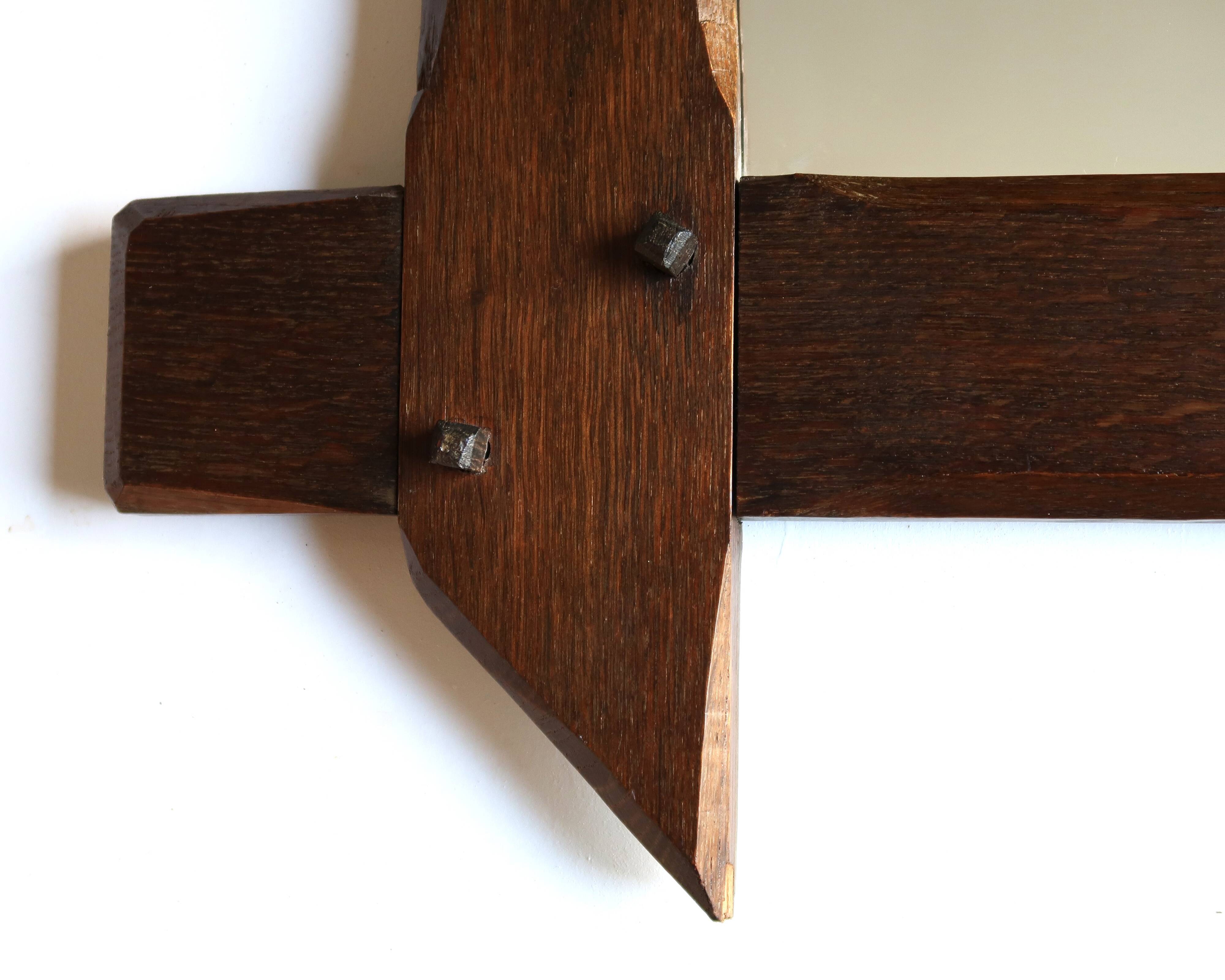 Rectangular mirror with bevelled wooden frame, 1970s.