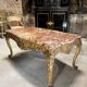 Table de milieu en bois doré d’époque napoléon iii dessus de marbre rouge
