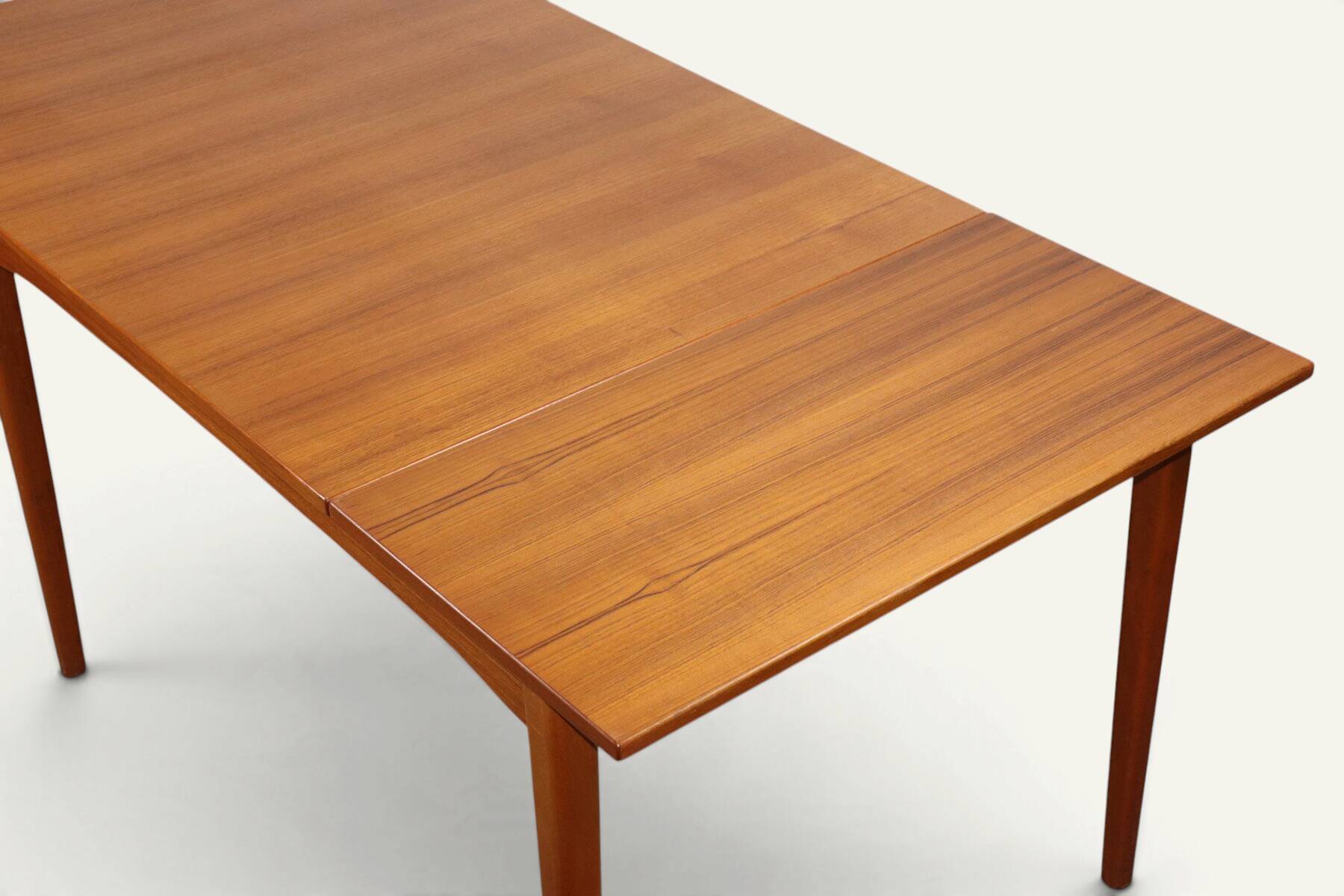 Rectangular extendable dining table in Scandinavian teak – 1960s