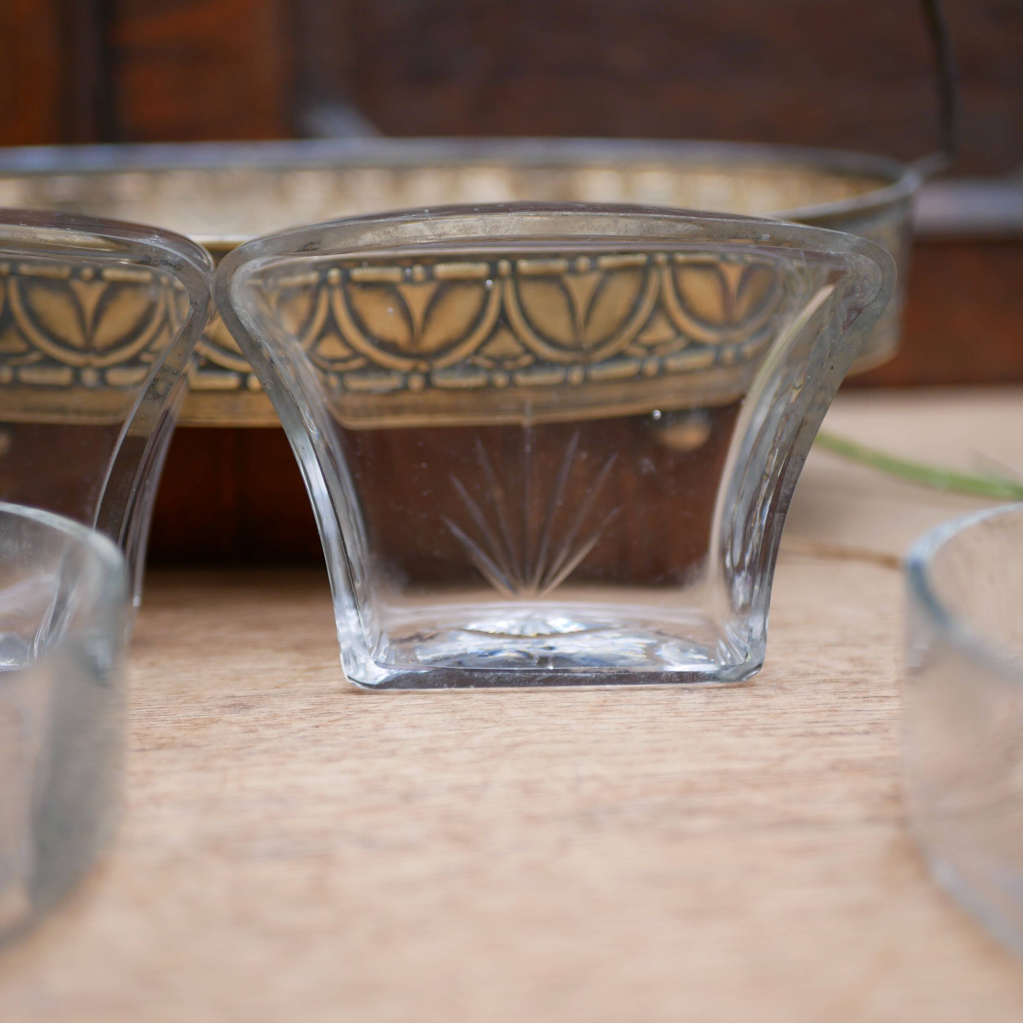 Art Nouveau serving dish plated in copper with removable glass inserts.